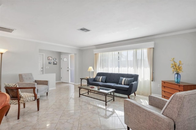 living area featuring visible vents, crown molding, and baseboards