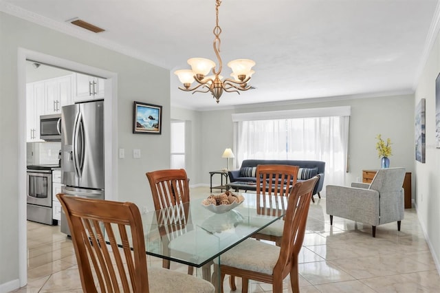 dining room with visible vents, crown molding, a notable chandelier, and baseboards