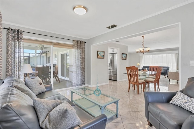 living room with light tile patterned floors, a chandelier, visible vents, baseboards, and ornamental molding