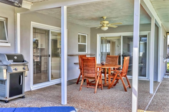 view of patio / terrace with area for grilling and a ceiling fan