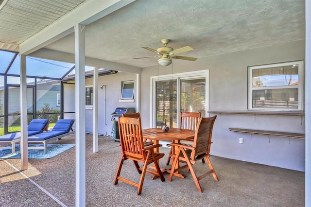 sunroom featuring ceiling fan