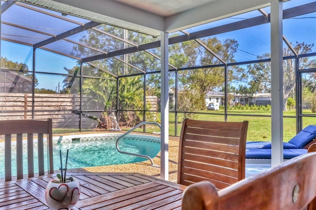 outdoor pool with a lanai and a yard