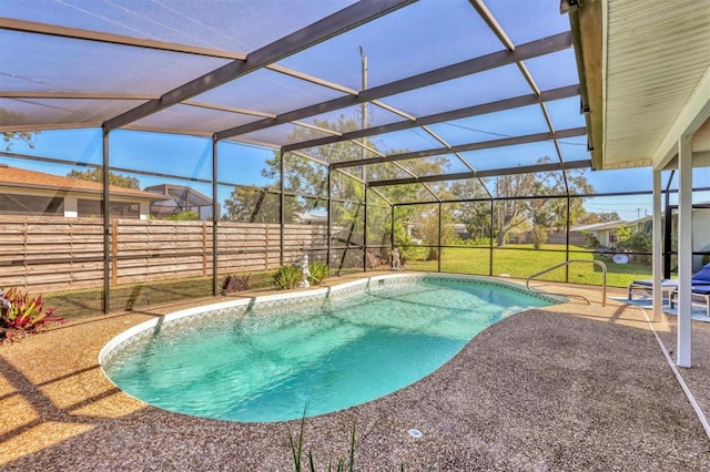 view of pool featuring a fenced in pool, a patio, glass enclosure, fence, and a yard