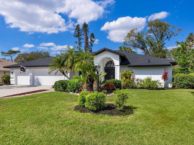 single story home with a garage, driveway, a front lawn, and stucco siding