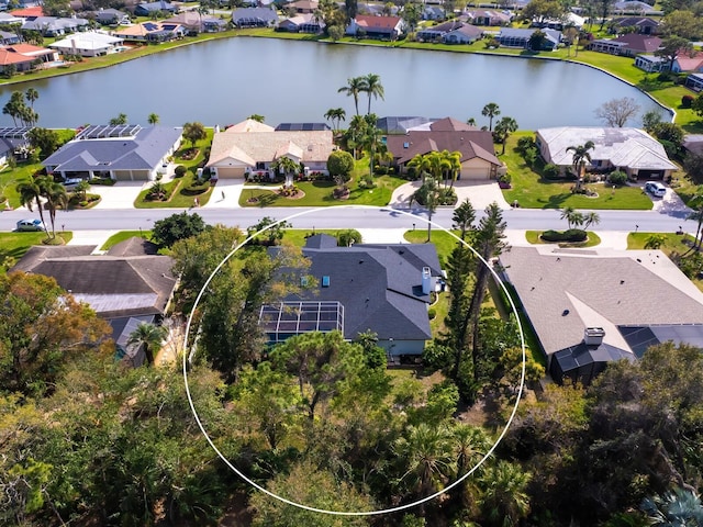 aerial view with a residential view and a water view