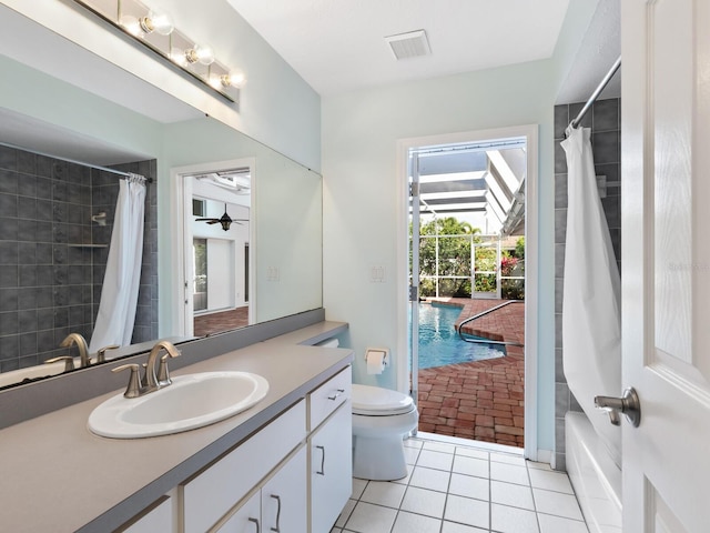 bathroom featuring toilet, vanity, tile patterned flooring, and visible vents