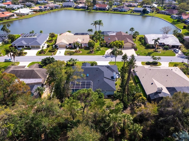 birds eye view of property featuring a residential view and a water view