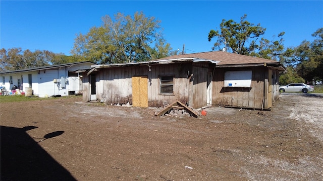 view of front of house with roof with shingles