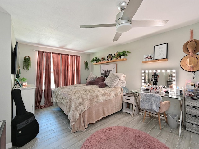 bedroom with wood tiled floor and ceiling fan