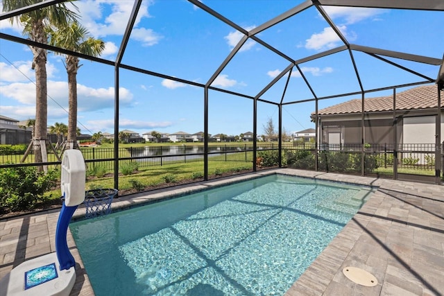 view of swimming pool with a fenced in pool, a water view, fence, glass enclosure, and a patio