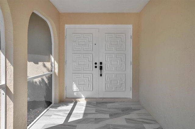 entrance foyer featuring arched walkways