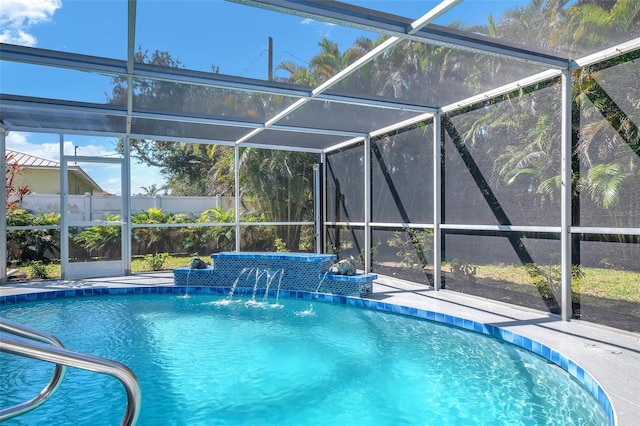 view of swimming pool with glass enclosure, a patio area, fence, and a fenced in pool