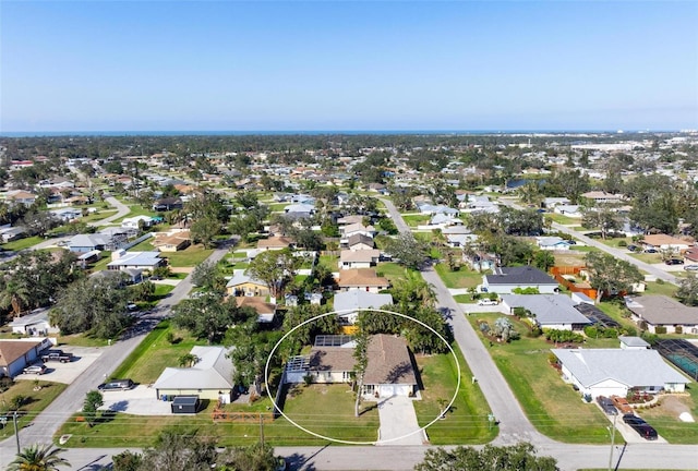 birds eye view of property with a residential view