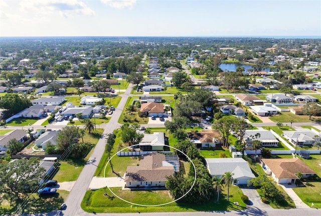 aerial view featuring a water view and a residential view