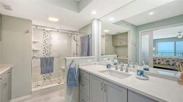 ensuite bathroom featuring visible vents, connected bathroom, and a shower stall