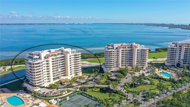 drone / aerial view with a city view and a water view