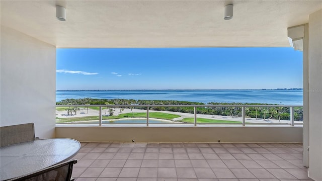 balcony featuring a water view