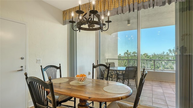 tiled dining room featuring a chandelier