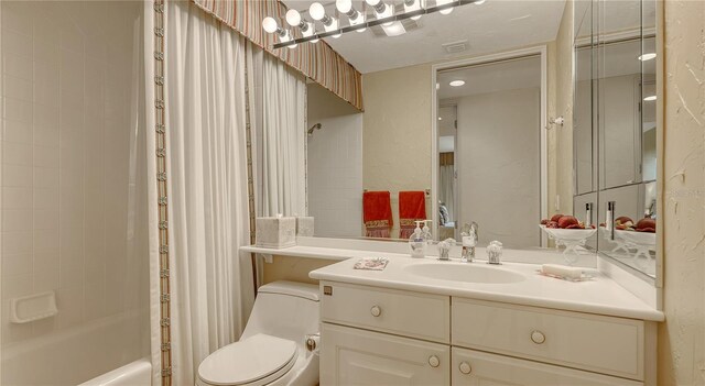 full bathroom featuring visible vents, shower / tub combo, toilet, and vanity