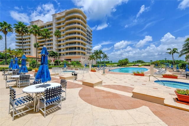 pool featuring a patio area and a hot tub