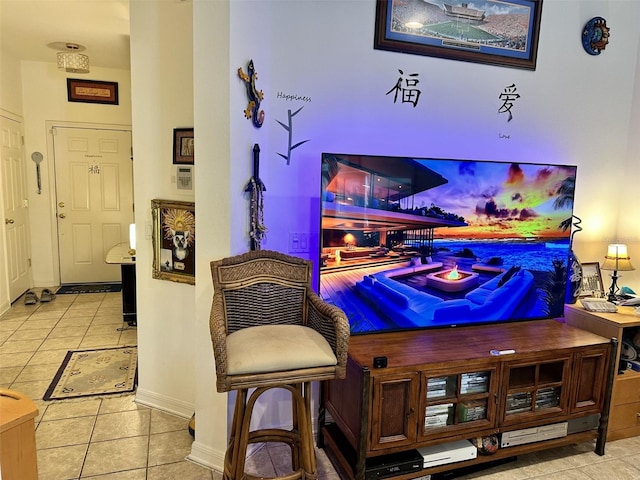 bar featuring tile patterned floors and baseboards