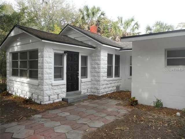 775 36th Ave S, Saint Petersburg, FL 33705 - exterior space featuring roof with shingles and a chimney