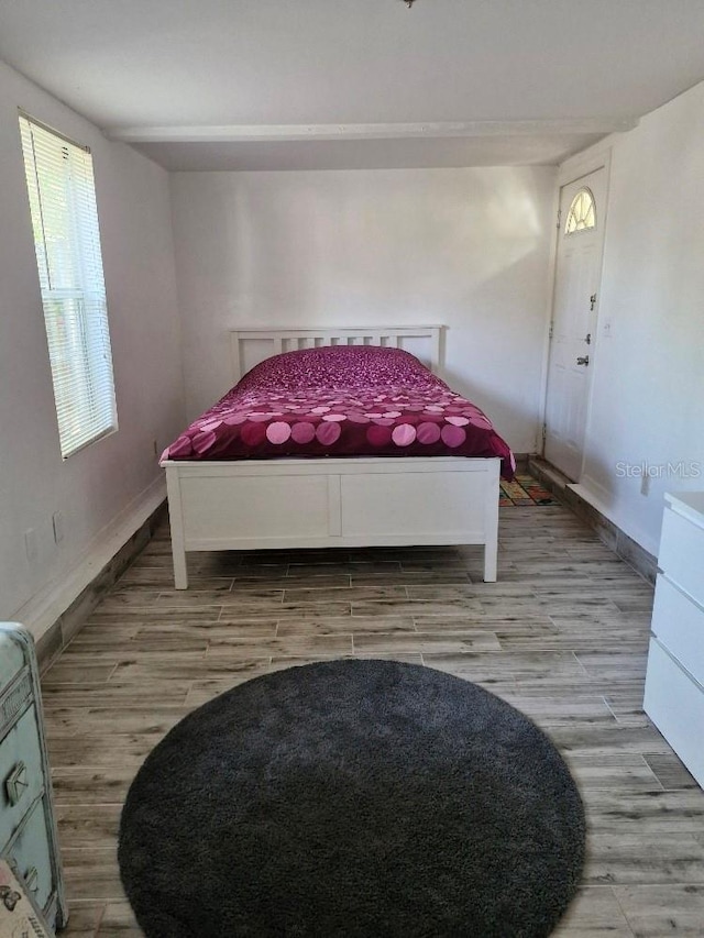 775 36th Ave S, Saint Petersburg, FL 33705 - bedroom with baseboards and wood finished floors