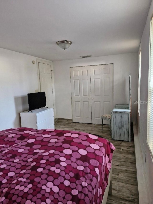 775 36th Ave S, Saint Petersburg, FL 33705 - unfurnished bedroom with a closet, visible vents, and wood finished floors
