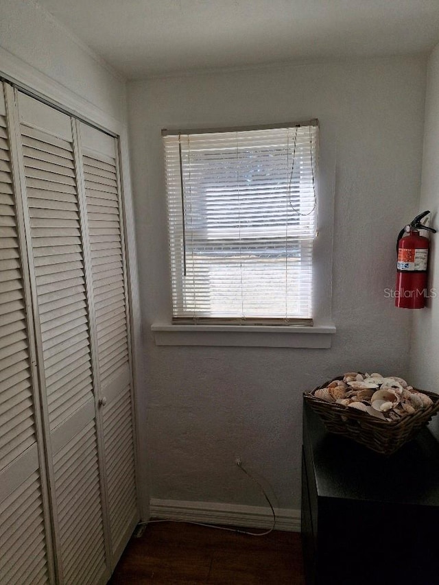 775 36th Ave S, Saint Petersburg, FL 33705 - bedroom with a closet, dark wood finished floors, and baseboards