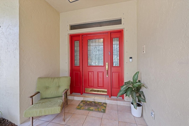 entrance to property with stucco siding