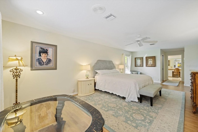 bedroom with baseboards, visible vents, ceiling fan, wood finished floors, and recessed lighting