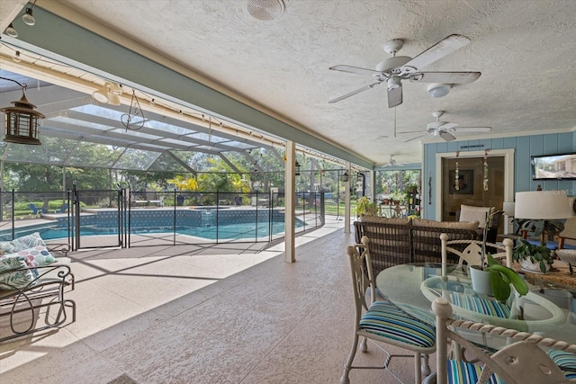 sunroom featuring a swimming pool