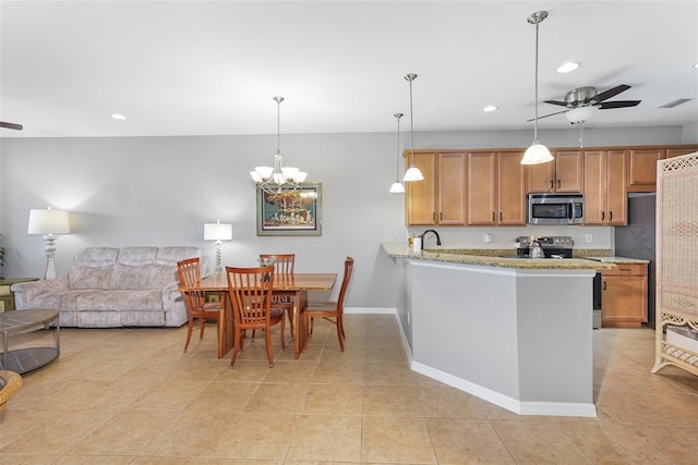 kitchen with visible vents, appliances with stainless steel finishes, open floor plan, ceiling fan with notable chandelier, and recessed lighting