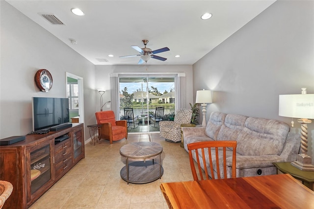 living room with light tile patterned flooring, ceiling fan, visible vents, and recessed lighting