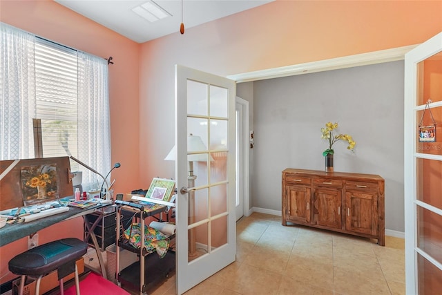 office area featuring baseboards, light tile patterned flooring, and french doors