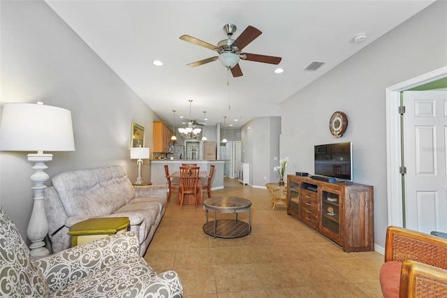 living area with recessed lighting, visible vents, baseboards, ceiling fan with notable chandelier, and light tile patterned flooring