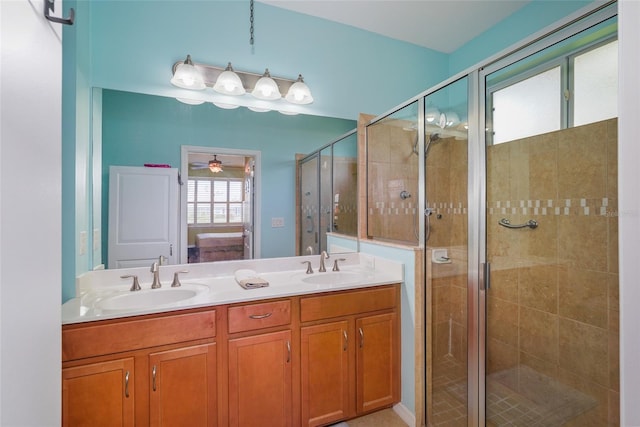 full bath with a shower stall, a sink, and ensuite bathroom