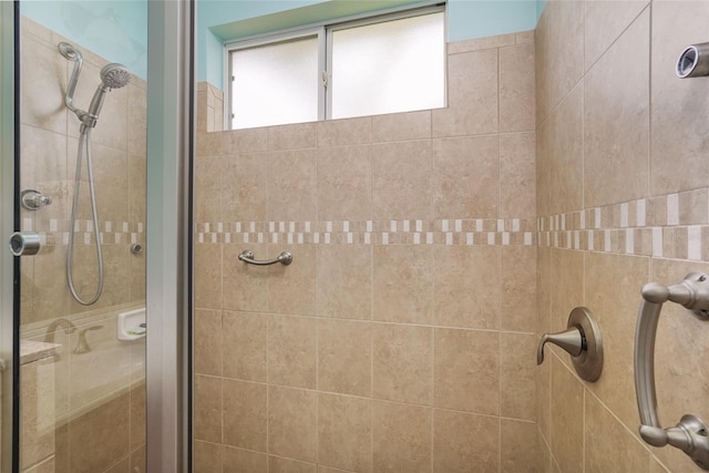 bathroom with a shower stall