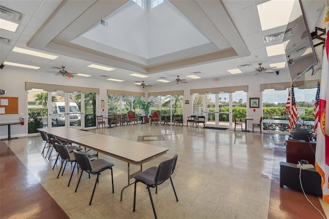 dining room with a healthy amount of sunlight, visible vents, a drop ceiling, and french doors