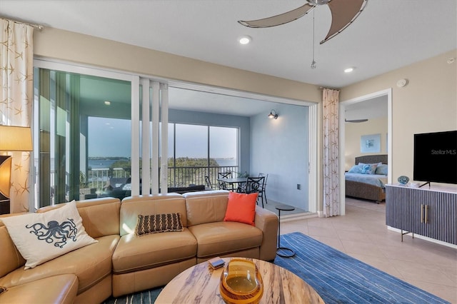 living area featuring a ceiling fan, recessed lighting, and tile patterned floors