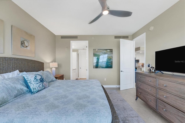 bedroom with a ceiling fan, visible vents, baseboards, and light tile patterned floors