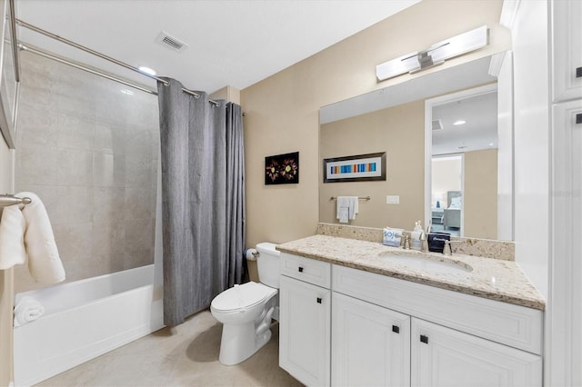 full bath with visible vents, toilet, tile patterned floors, shower / bath combo with shower curtain, and vanity