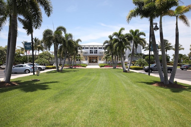 view of property's community with a yard