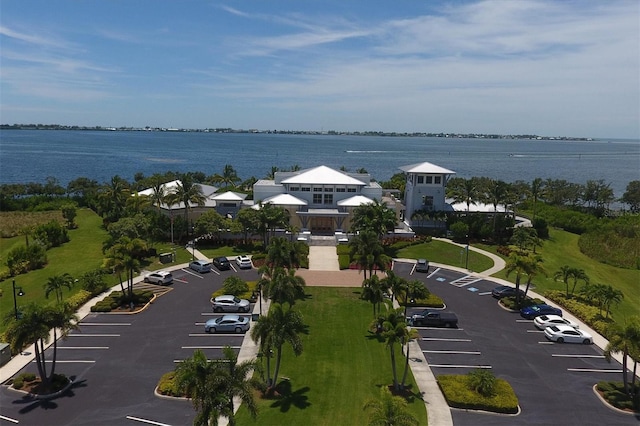 birds eye view of property with a water view