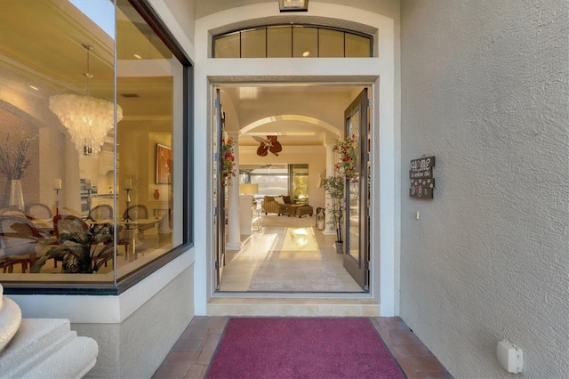 property entrance featuring stucco siding