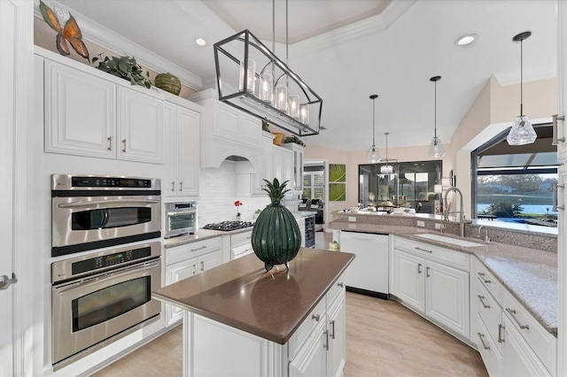 kitchen with a sink, white cabinetry, stainless steel double oven, gas stovetop, and dishwasher