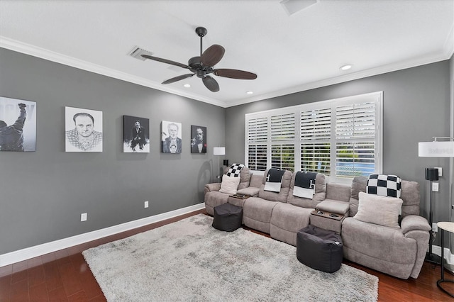 cinema room featuring a ceiling fan, dark wood-style floors, baseboards, recessed lighting, and ornamental molding