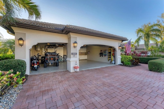 exterior space featuring decorative driveway