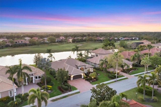 birds eye view of property with a residential view and a water view