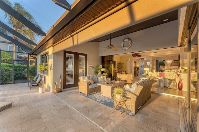 view of patio / terrace featuring a lanai, an outdoor hangout area, french doors, and ceiling fan